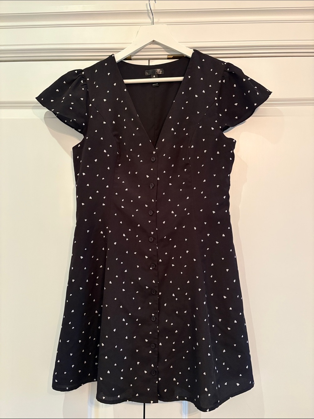 Black Cap Sleeve Mini Dress with White Heart Design